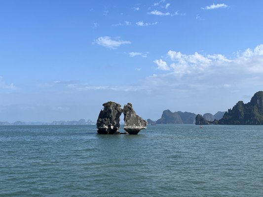 A large rock in the middle of a body of water — Ha Long Bay, Vietnam
