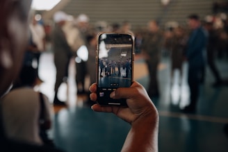 a person taking a picture of a group of people