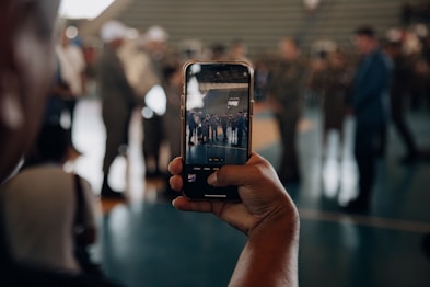 a person taking a picture of a group of people