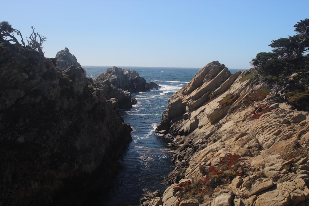 a view of the ocean from a rocky cliff