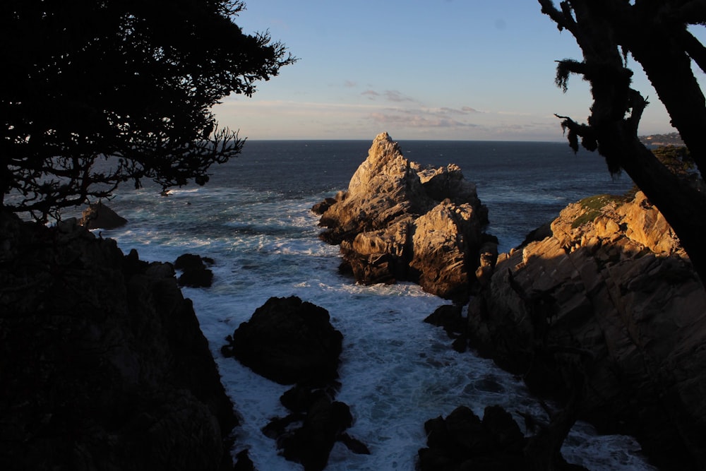 a view of the ocean from a rocky cliff