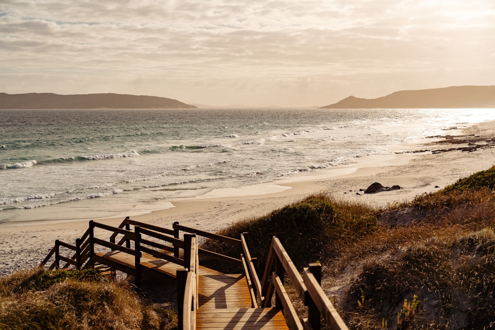 a wooden staircase leading down to the beach