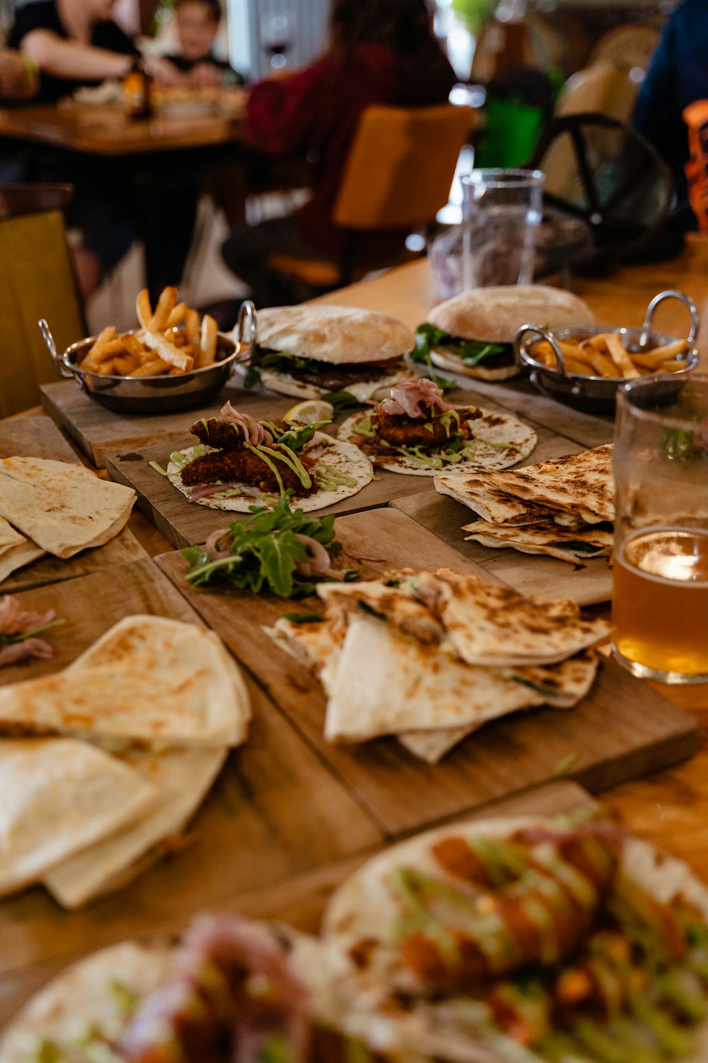 a wooden table topped with lots of food