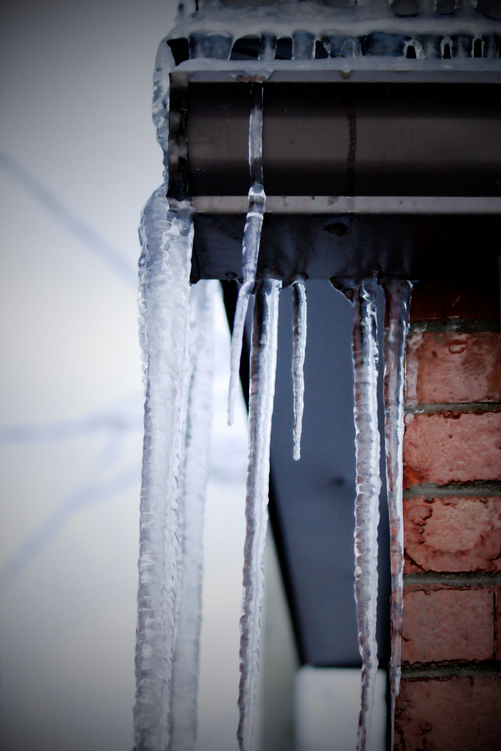 icicles hanging from the roof of a building