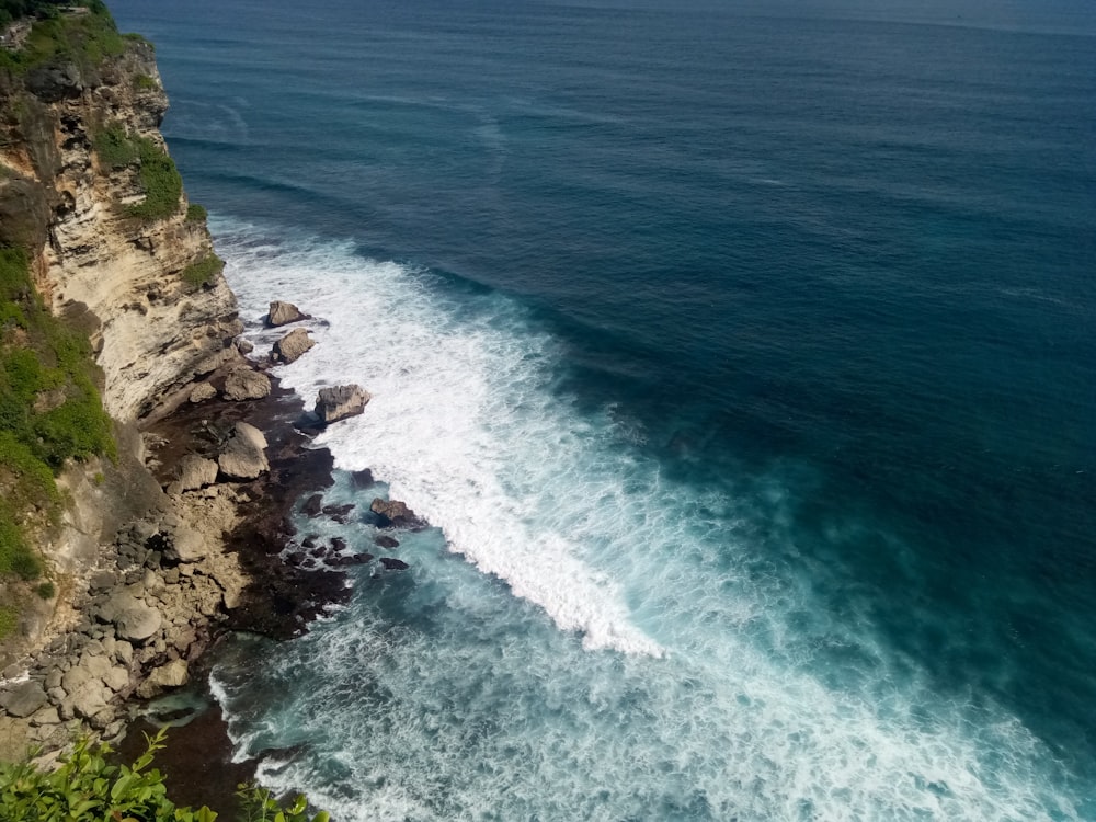 a view of the ocean from the top of a cliff