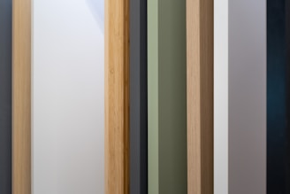 a close up of a wooden door with different colors