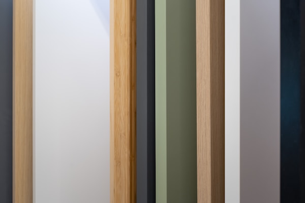 a close up of a wooden door with different colors