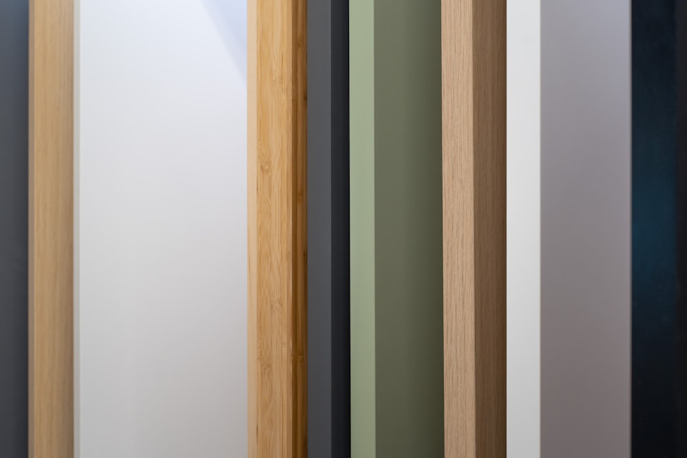 a close up of a wooden door with different colors