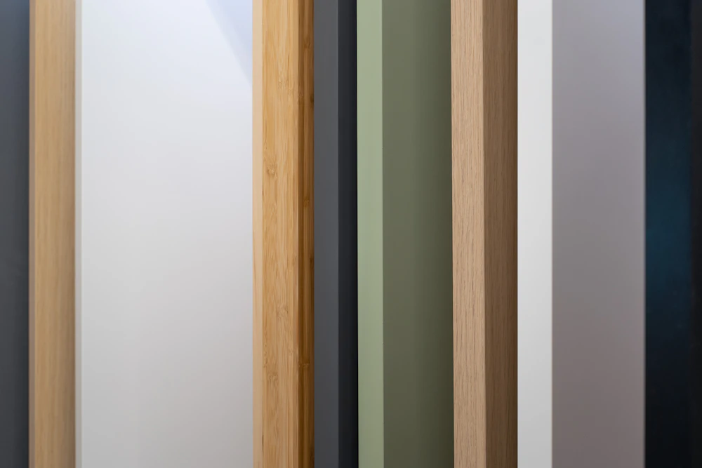 Close-up of wooden doors in different colours, an example of finish options for custom made doors in Abu Dhabi