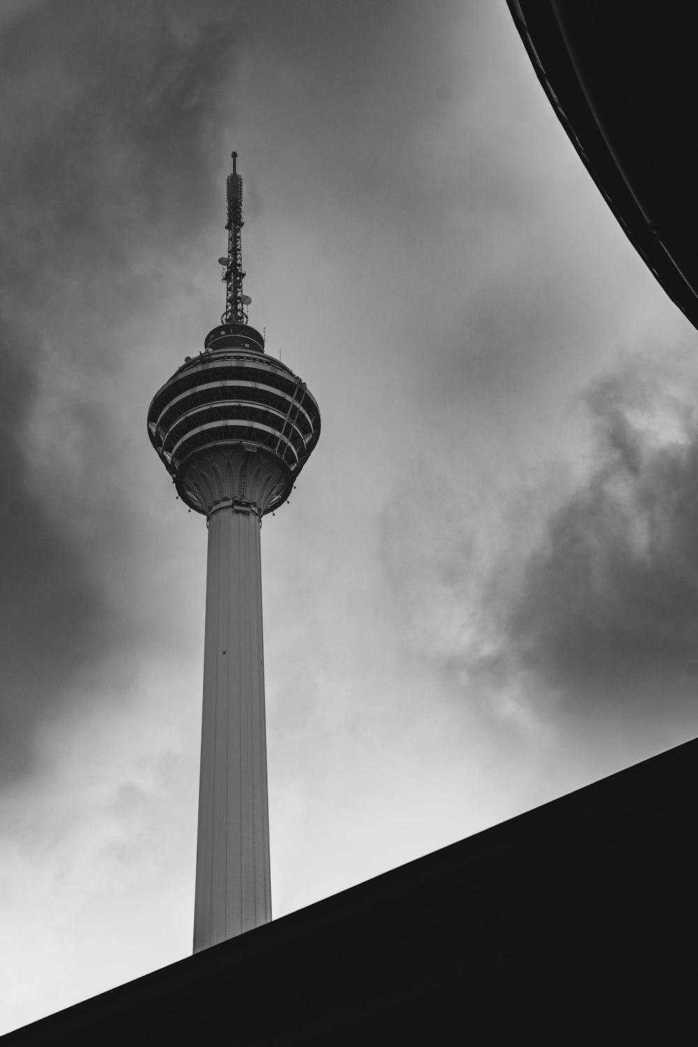 a black and white photo of a tall tower