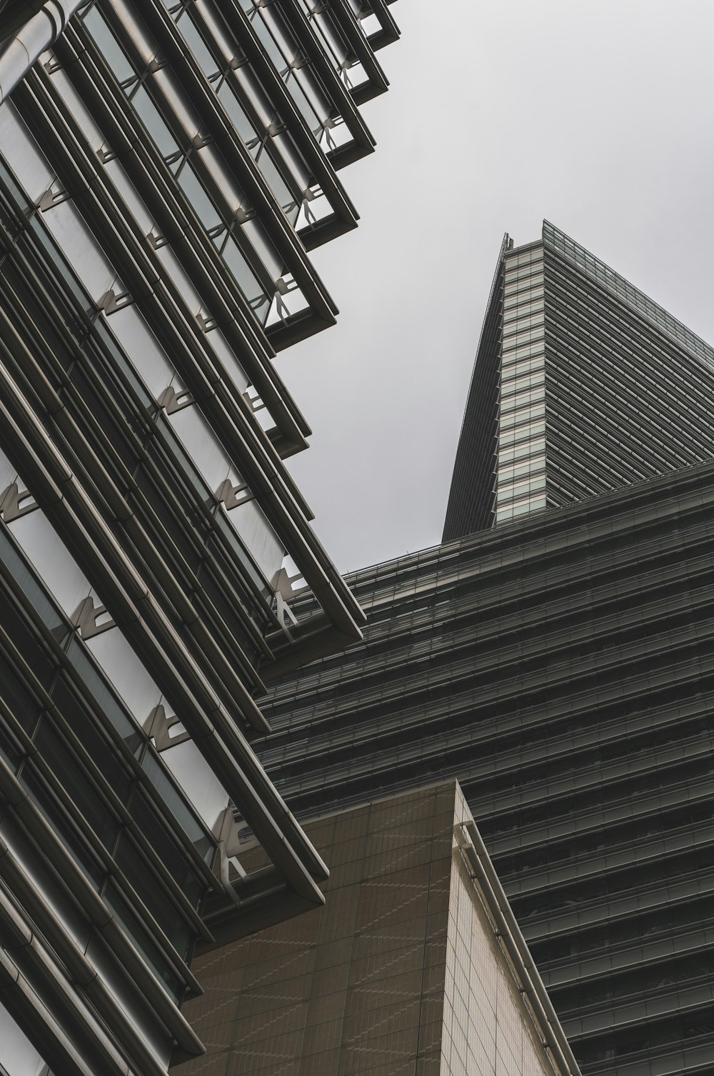 a very tall building next to a very tall building