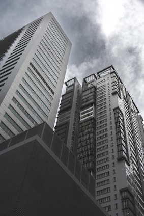 a couple of tall buildings sitting next to each other