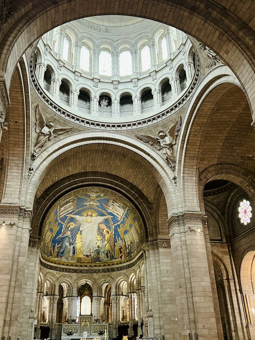 a large cathedral with a painting on the ceiling