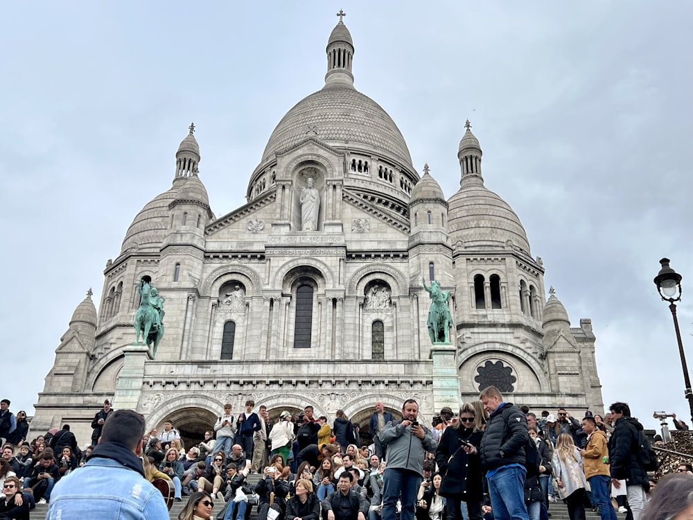 a group of people standing in front of a building