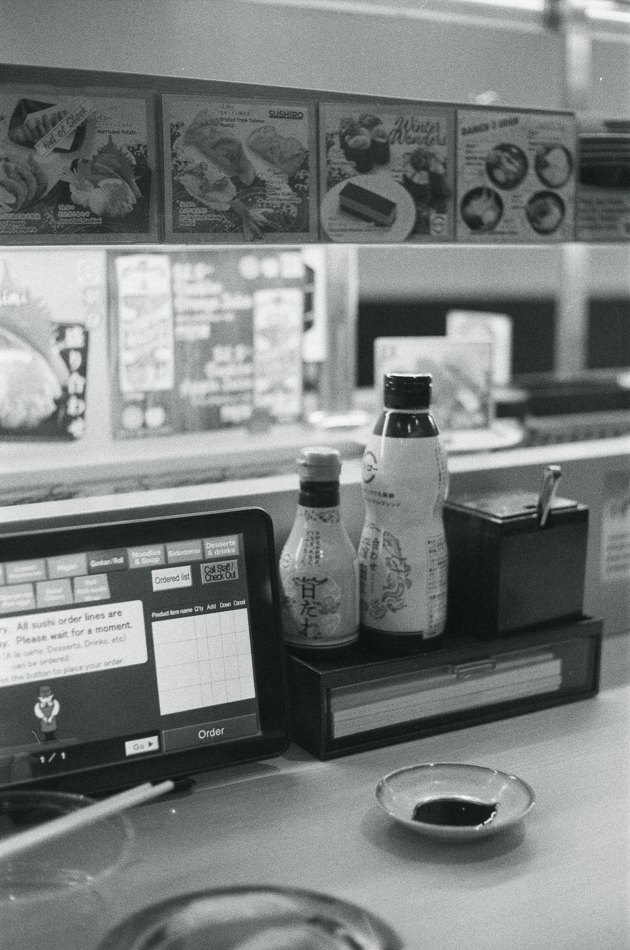 a laptop computer sitting on top of a counter