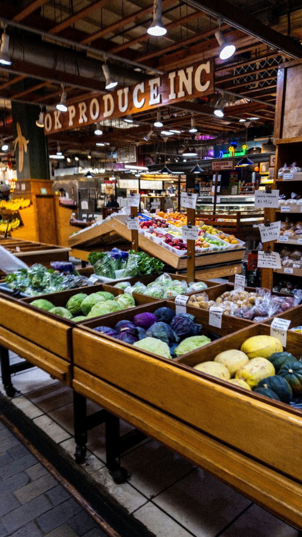 a produce section of a grocery store filled with produce