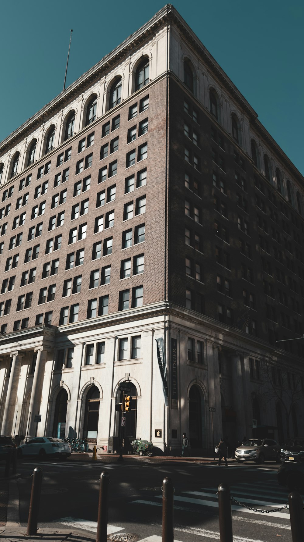 a large brown building with many windows on it