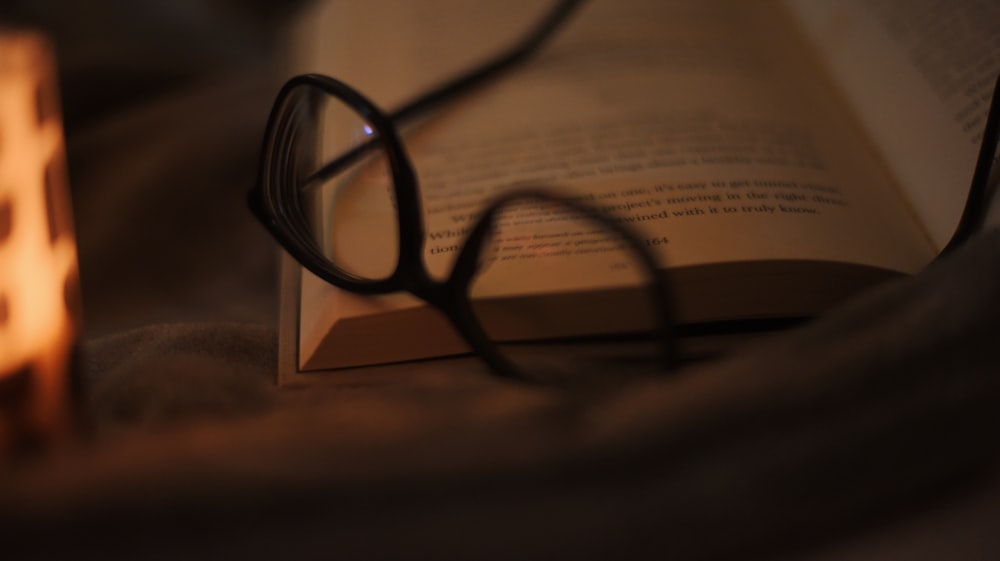 a book with a pair of glasses on top of it