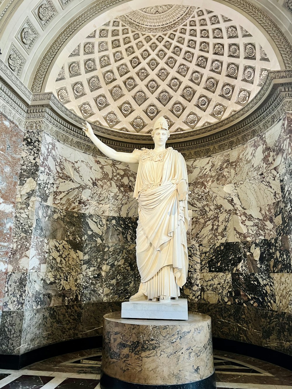 a statue of a woman in a marble room