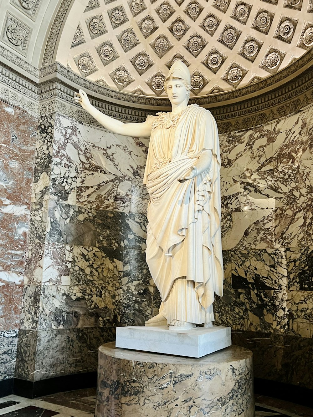 a statue of a man with his arms outstretched