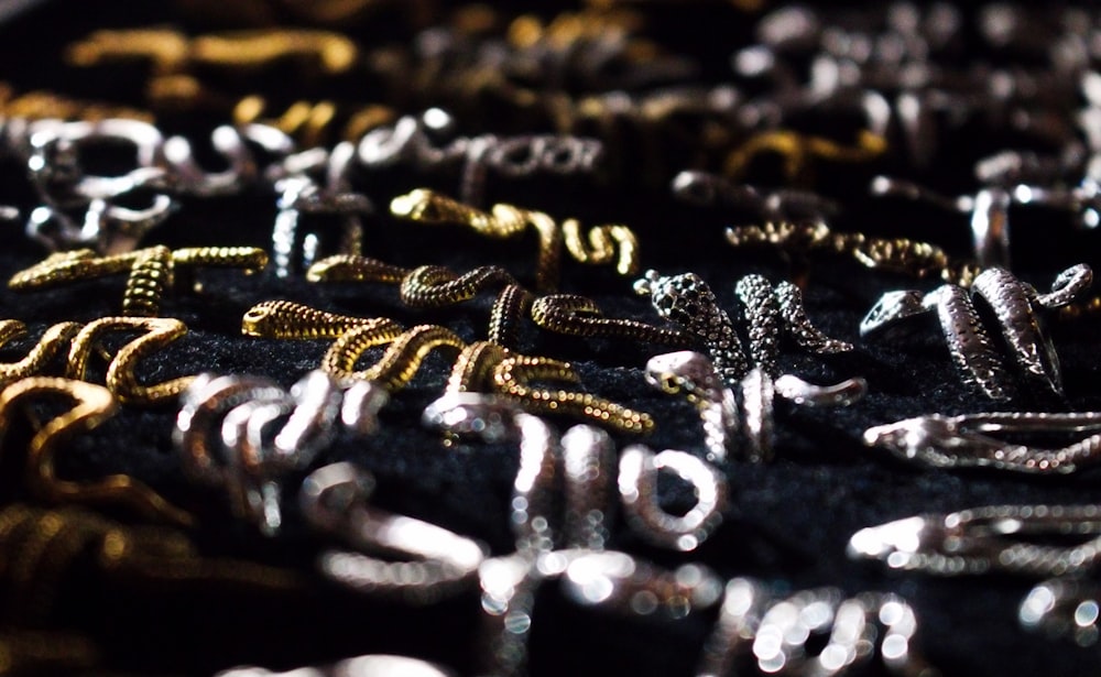 a close up of a black cloth with gold and silver letters
