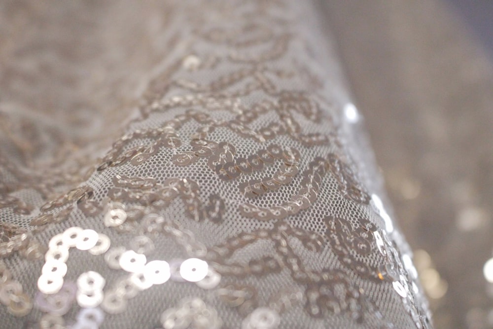 a close up of a piece of cloth with sequins on it