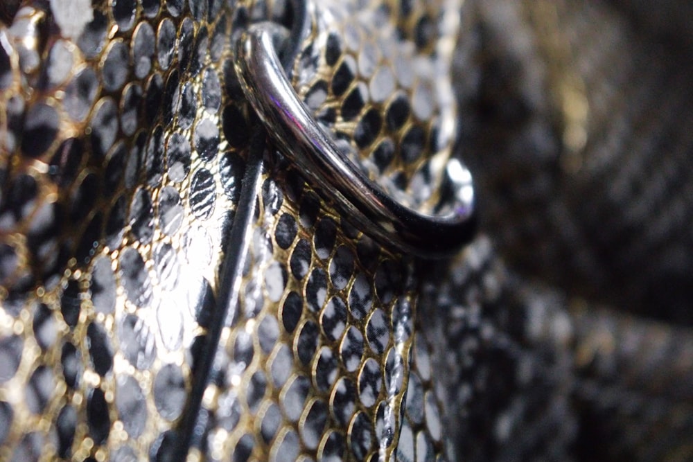 a close up of a wedding ring on a patterned cloth