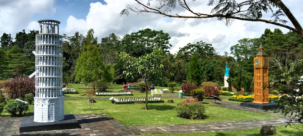 a statue of a tower in a park