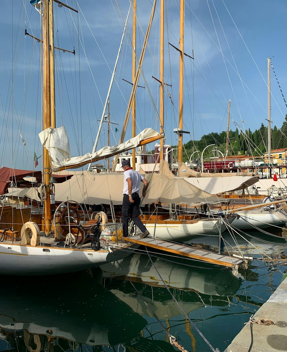 a couple of men standing on top of a boat