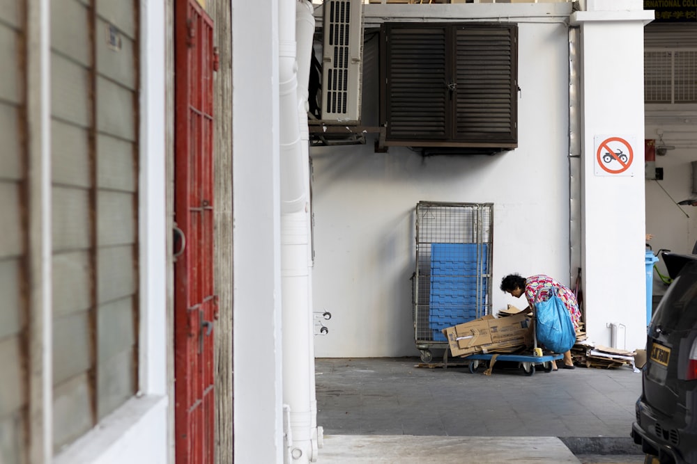 a person sitting on a bench in a garage