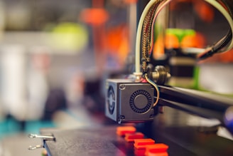 a close up of a machine with wires attached to it