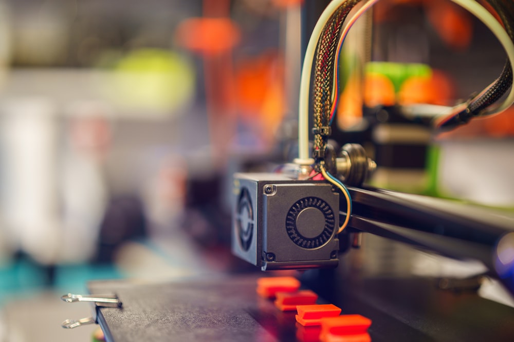 a close up of a machine with wires attached to it