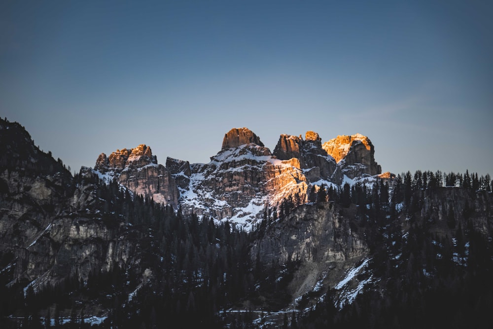 a group of mountains with snow on them