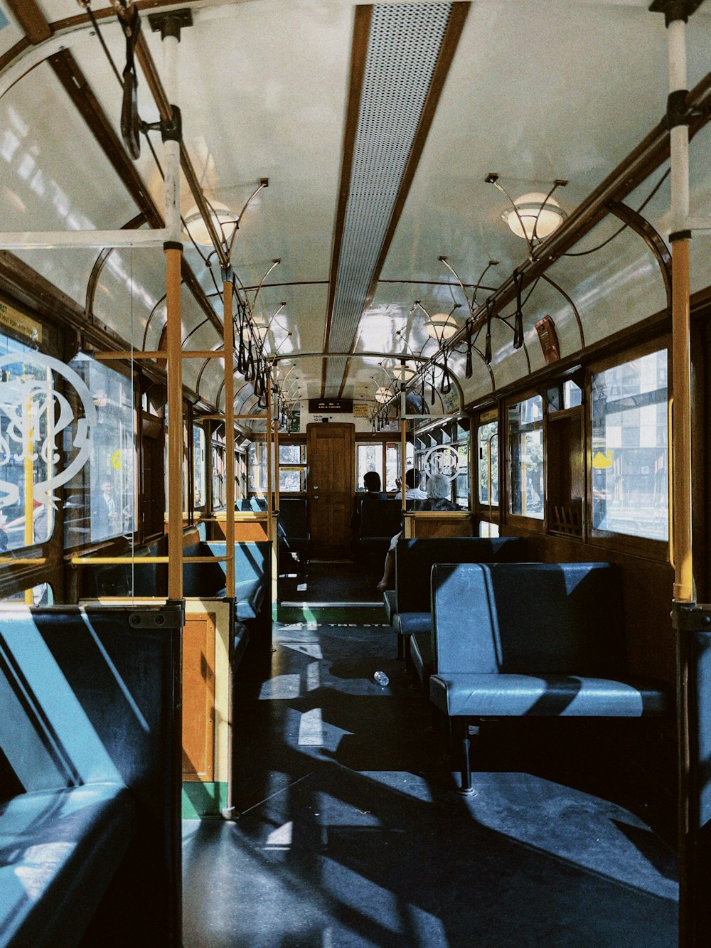 the inside of a train car with blue seats