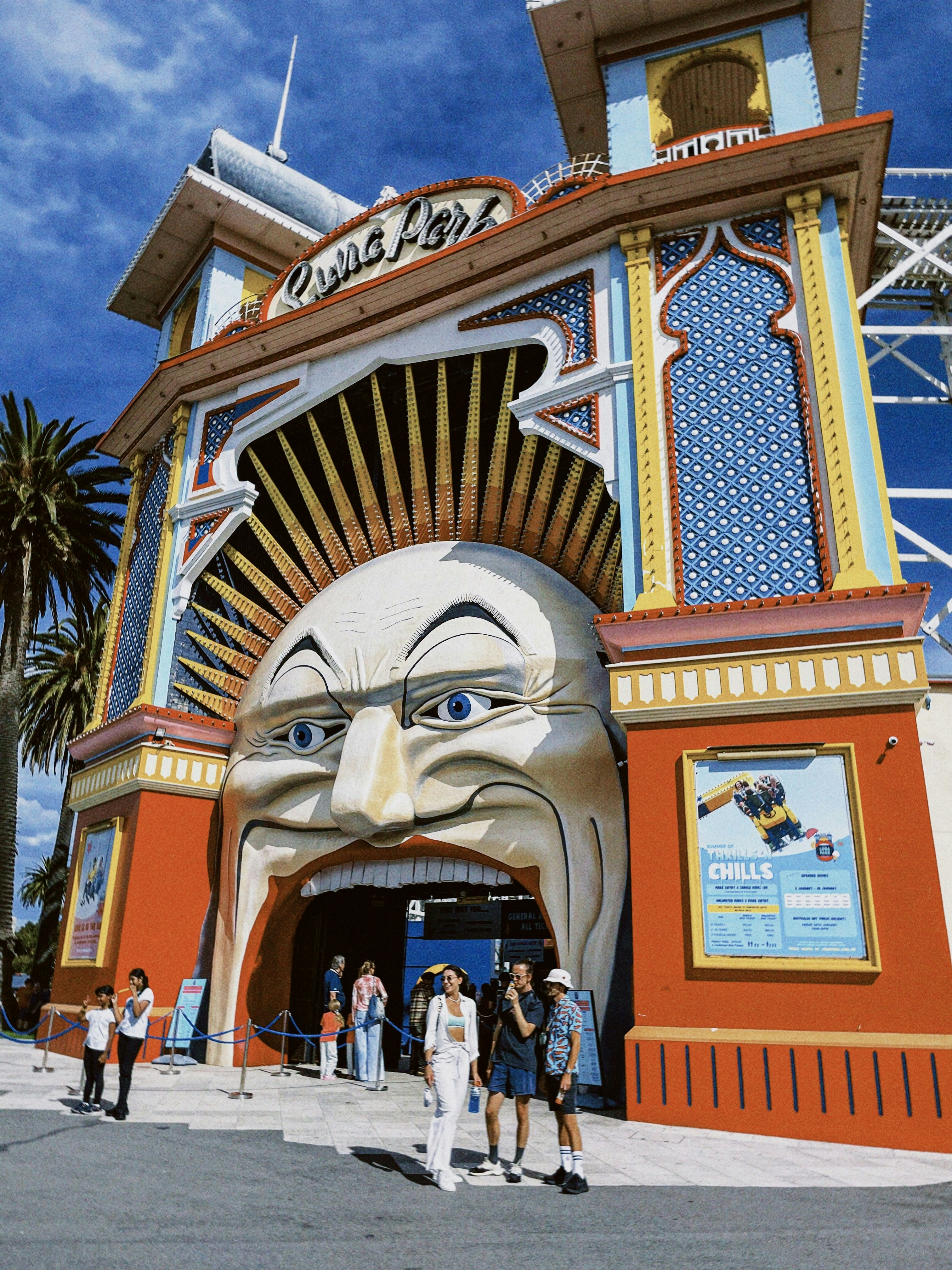 a large building with a giant face on it