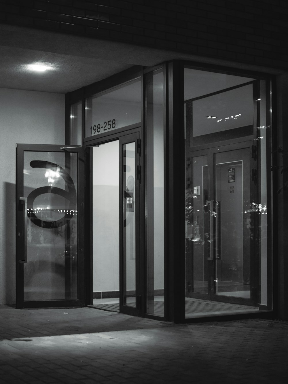 a black and white photo of an entrance to a building