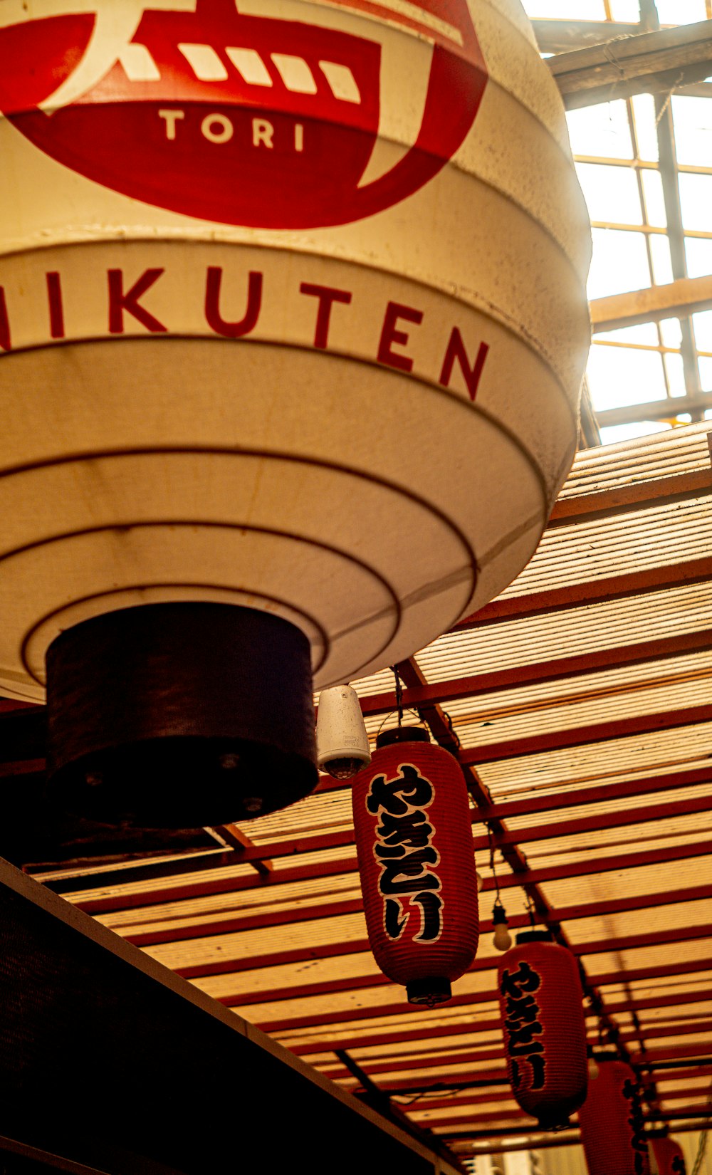 a large lantern hanging from the ceiling of a building