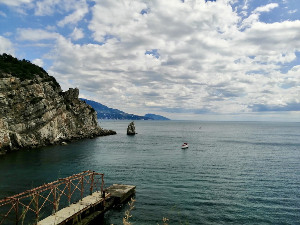 a body of water with a boat in the middle of it