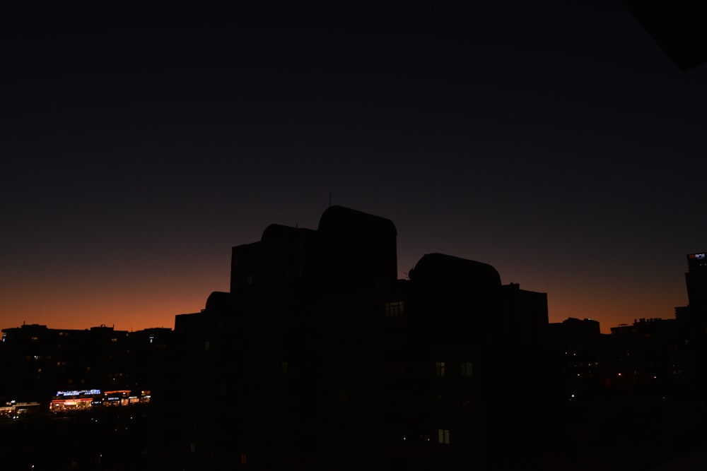 a view of a city at night from a rooftop