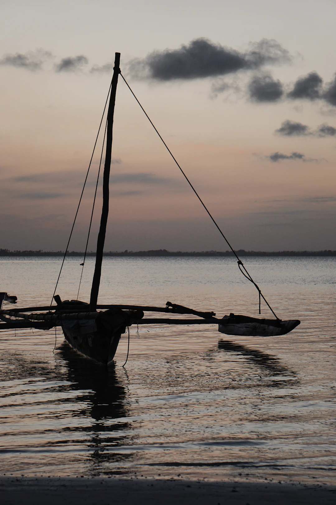 boat on calm water, portrait