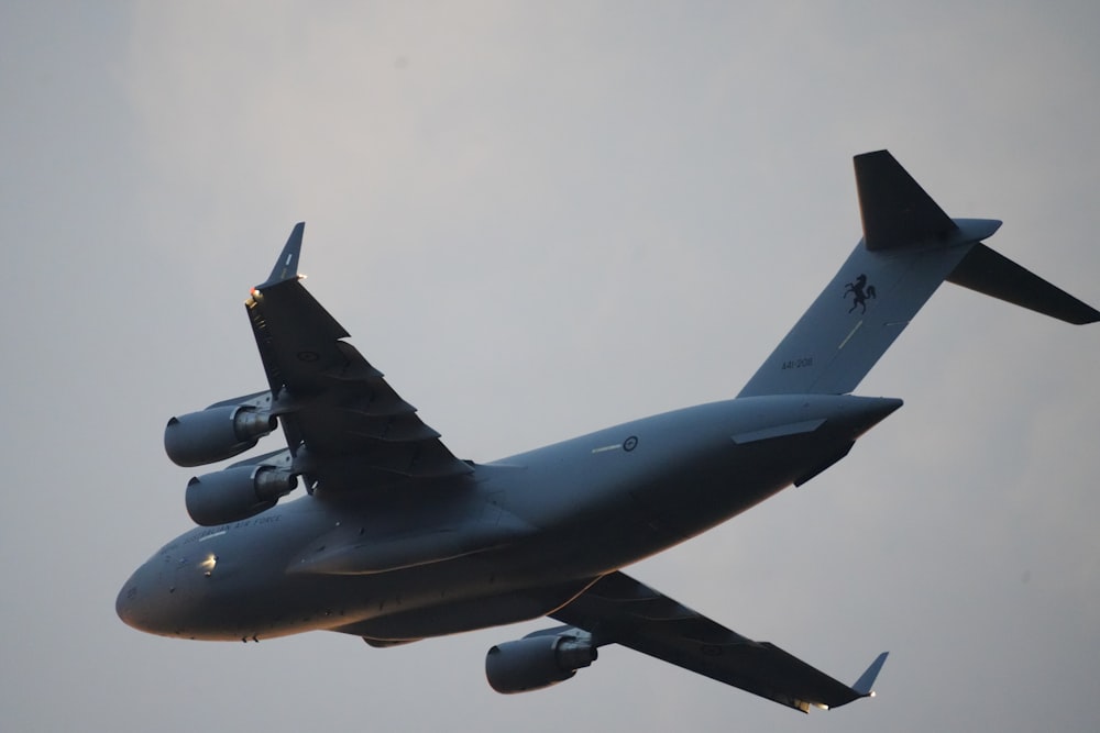 a large jetliner flying through a cloudy sky