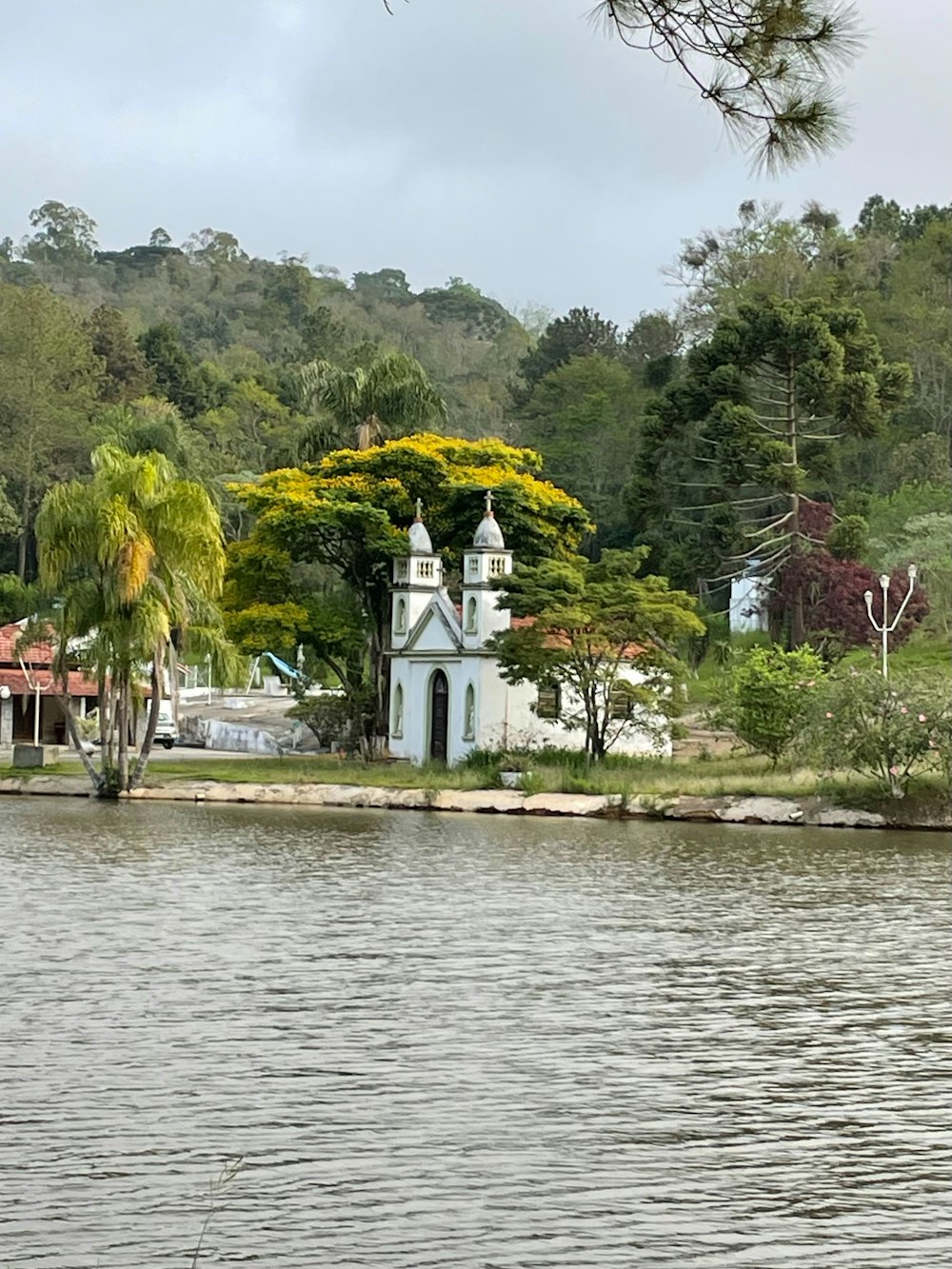 a church on the shore of a lake