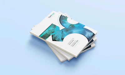a stack of four business cards on a blue background