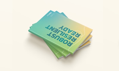 a stack of green and yellow business cards on top of each other