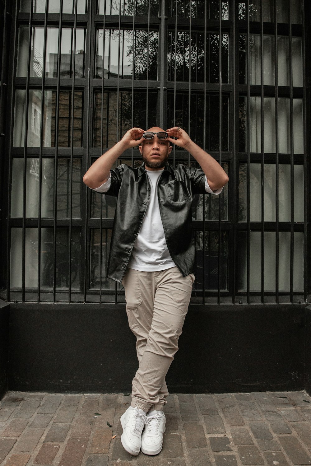 a man standing in front of a jail cell