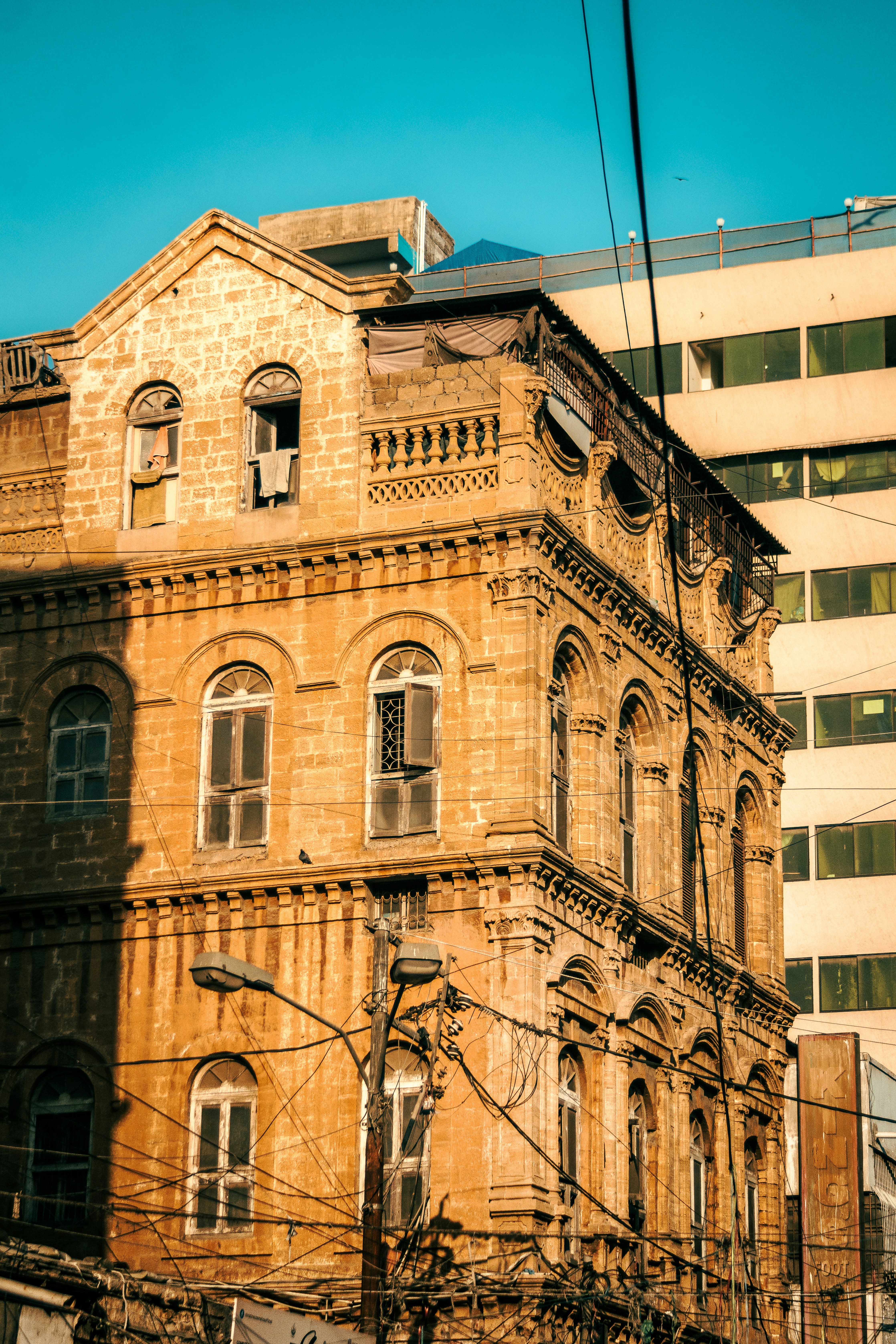 an old building with a clock on the front of it