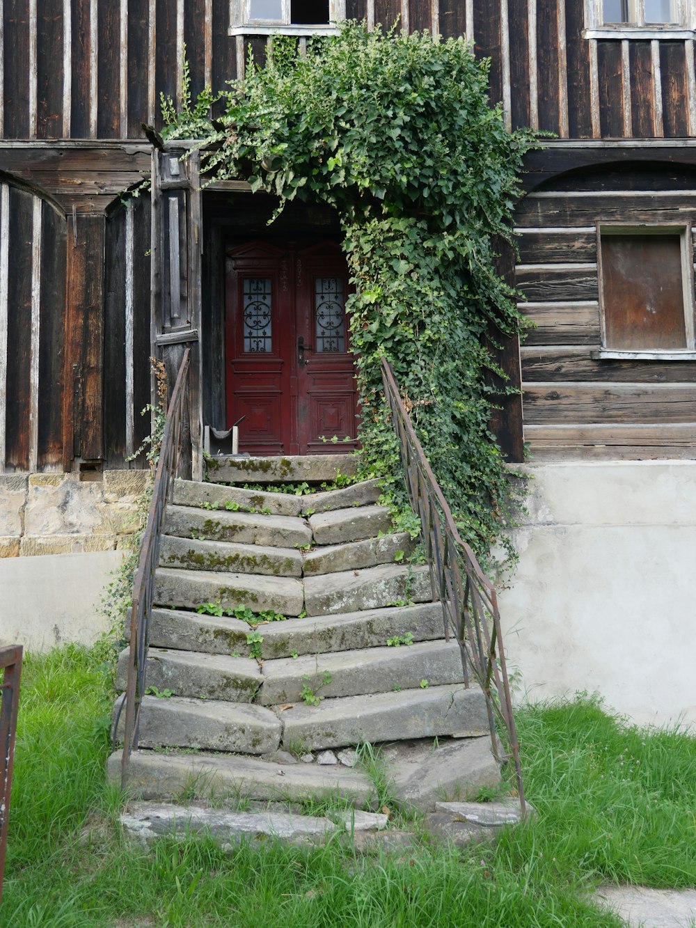 a set of stairs leading up to a wooden building