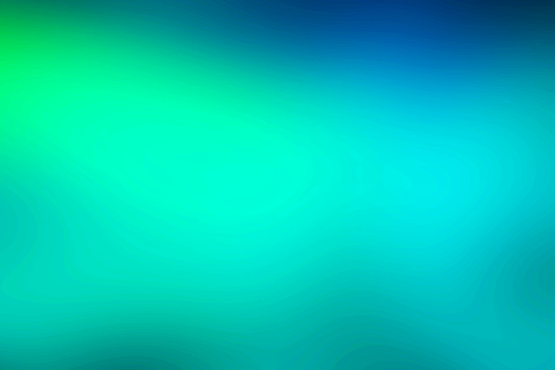 a blurry image of a green and blue background