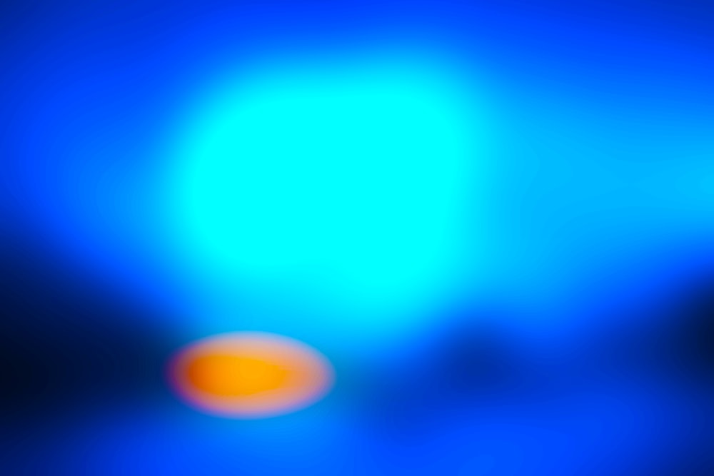 a blurry image of a blue and orange object