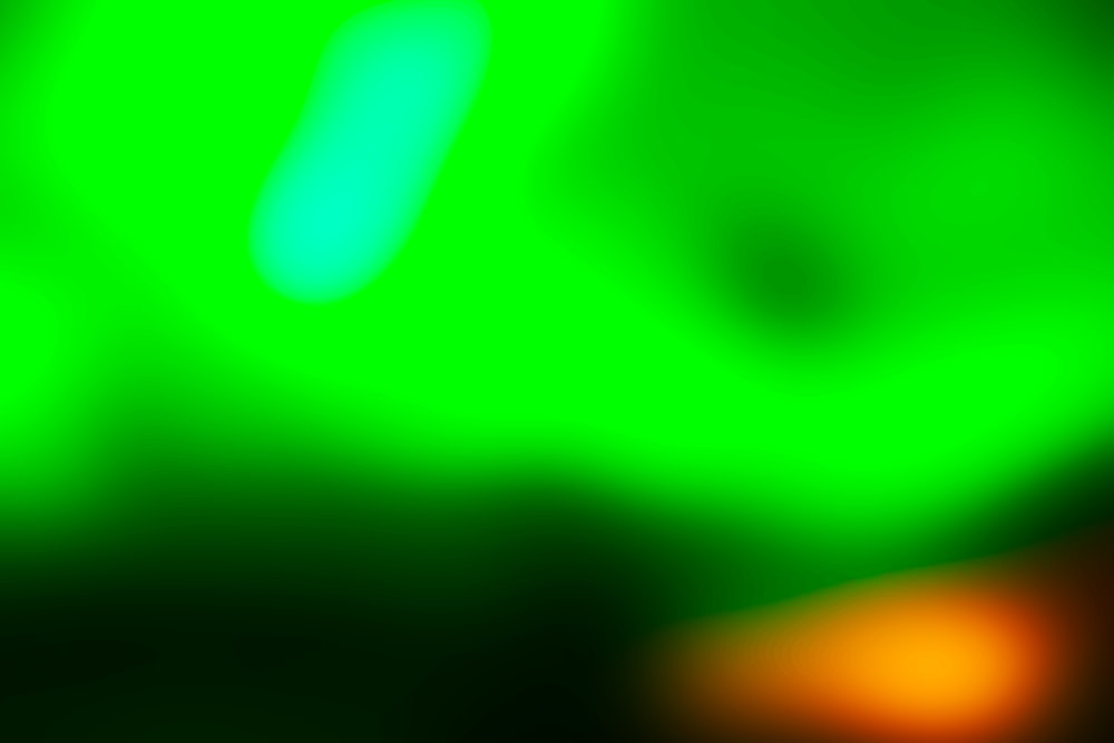 a blurry image of a green and yellow object